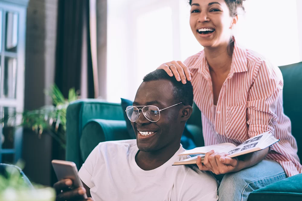 Couple Sitting In Living Room